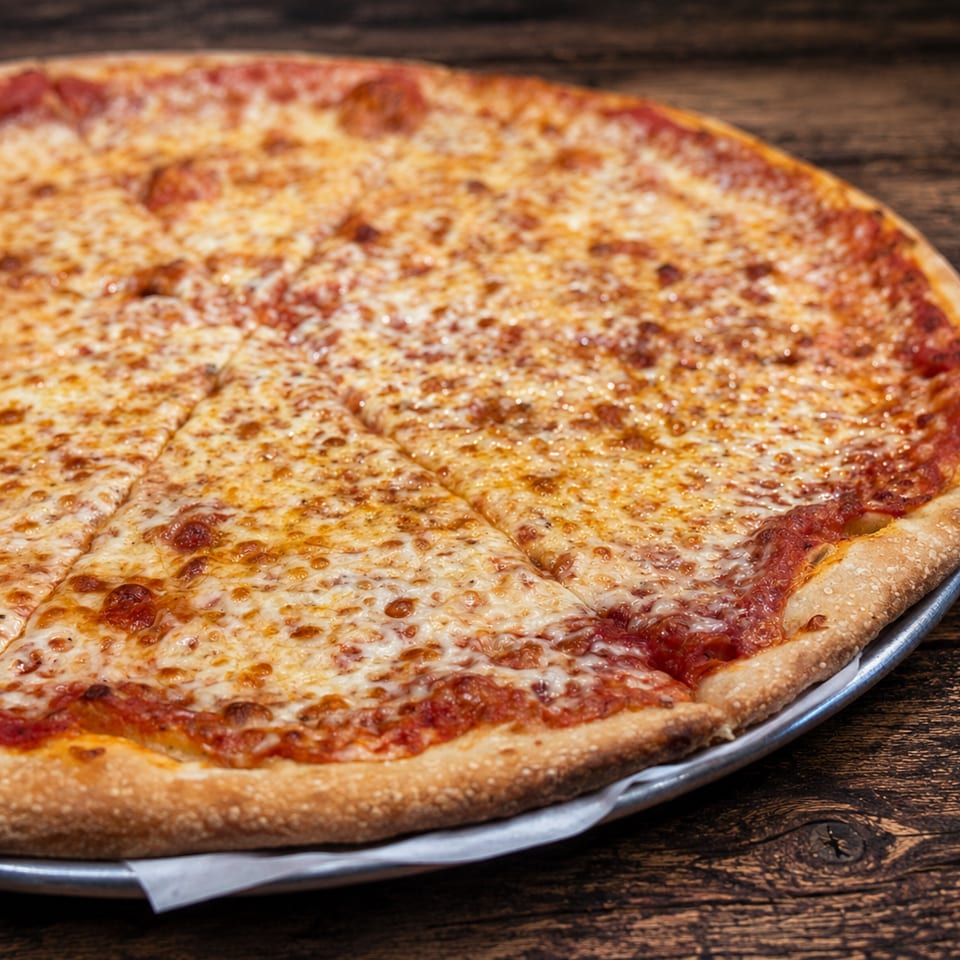 A classic cheese pizza with a crispy crust, sliced and ready to eat on a wooden table.